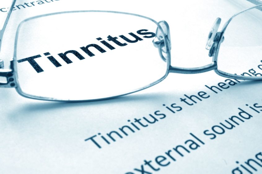 the word tinnitus behind glasses
