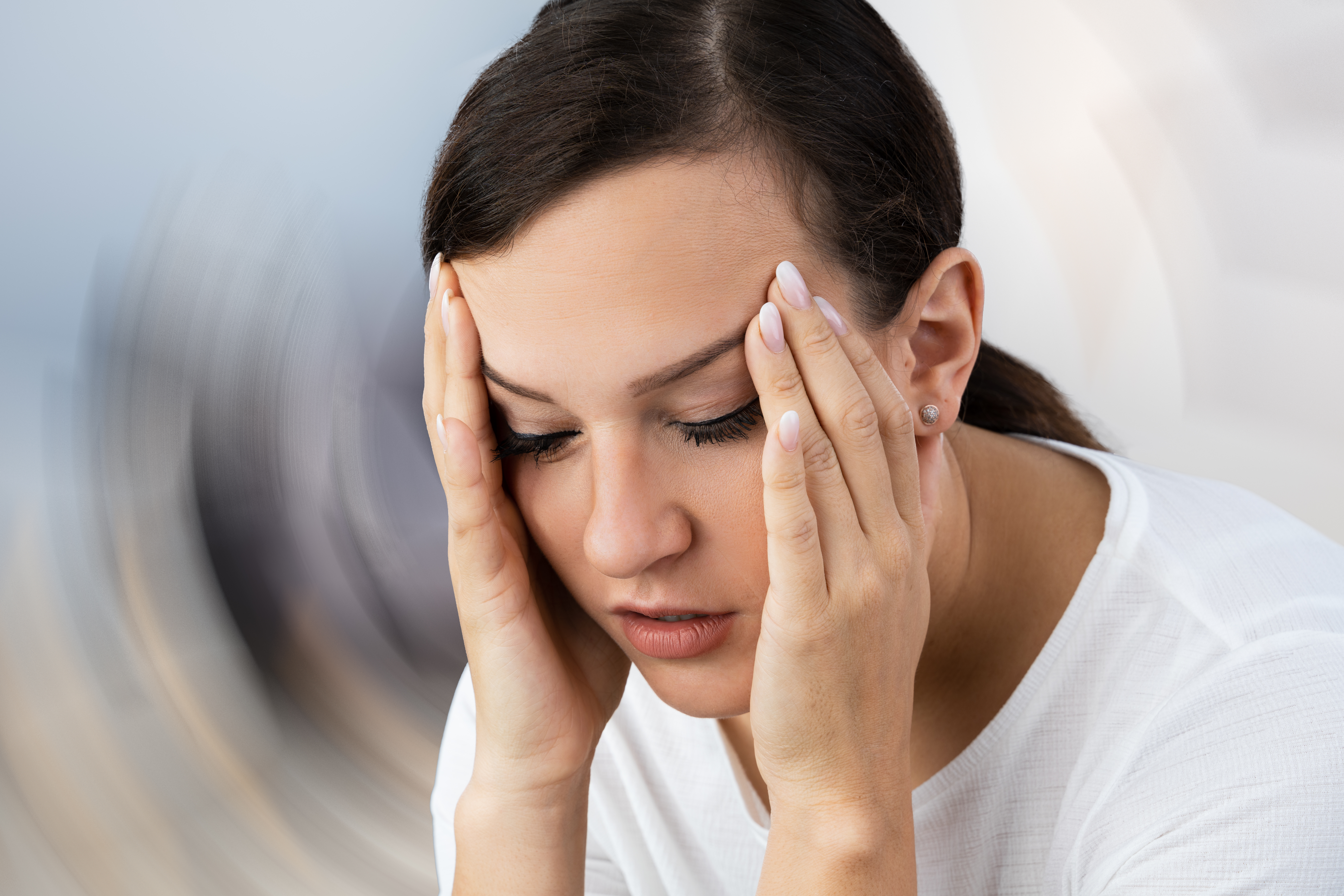 Woman Suffering From Headache & Dizziness