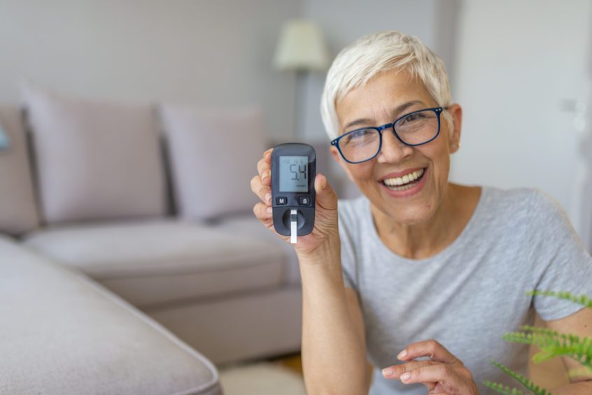 Concerned senior women doing blood sugar test at home