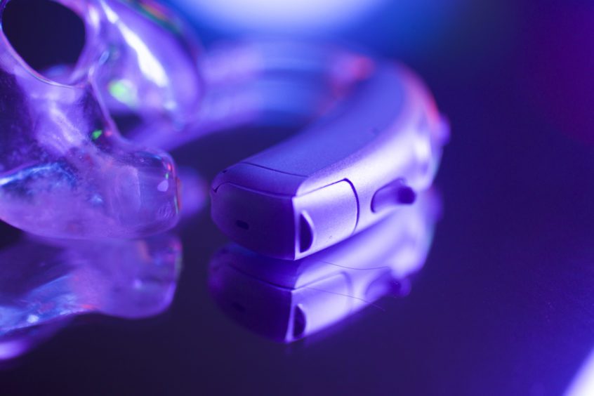 hearing aid sitting on glass table