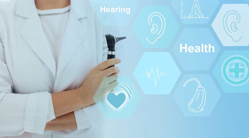 Care provider using an otoscope beside a graphic with hearing and hearing health icons.