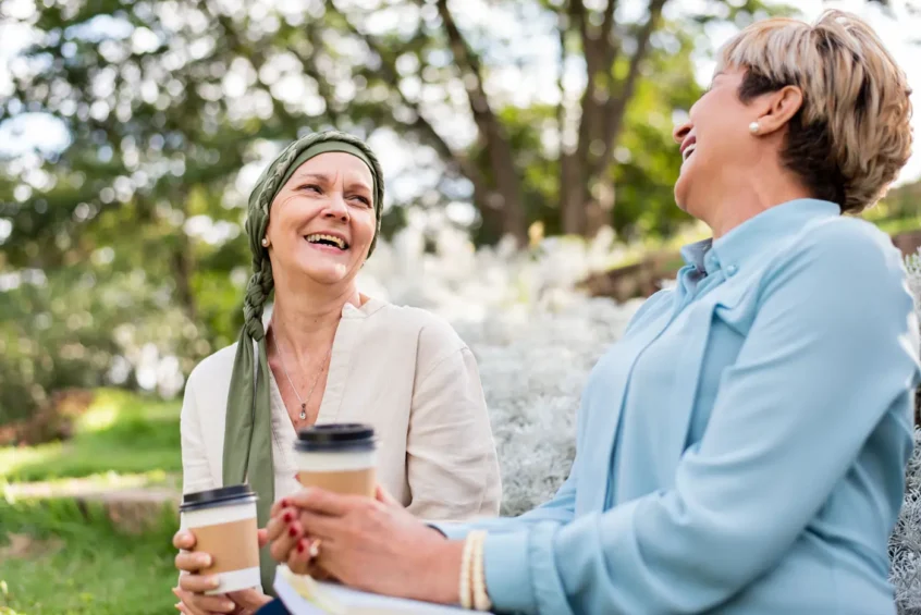 a cancer patient listening to a friend, Associated Audiologists Kansas City 2025