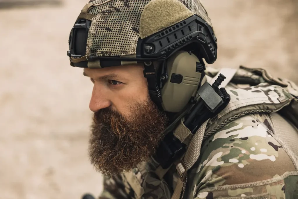 A veteran in uniform and helmet.